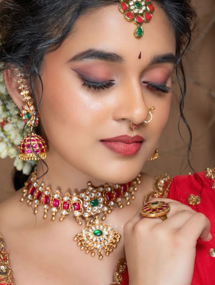 Traditional bridal makeup look with heavy jewelry in Siliguri